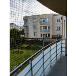 Montaż siatki zabezpieczającej na balkon dla kota Warszawa